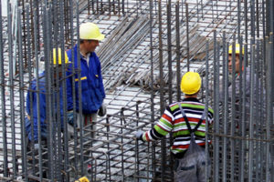 Construction armature Installing binding wires to reinforcement steel bars at construction site