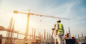2-1 Construction worker surveying construction site